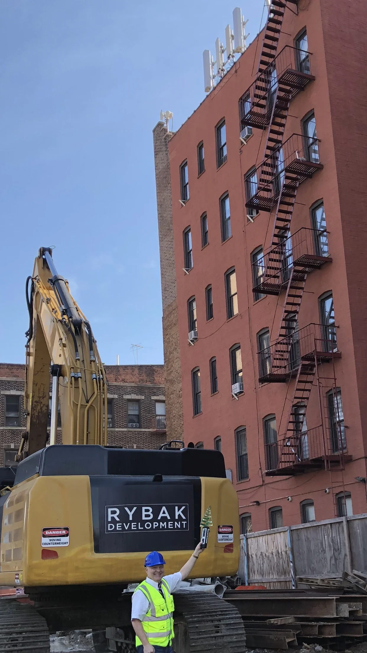Rybak Development, a world-class design and construction firm based in NYC, hired us because of their conscientious concern for employee health and safety. We provided EMF mitigation consulting for the construction of a new 20-story luxury residential building which will soon be the pride of Brighton Beach. (The building in the photo is nearby the site and that’s our Senior Consultant, James Finn.)
