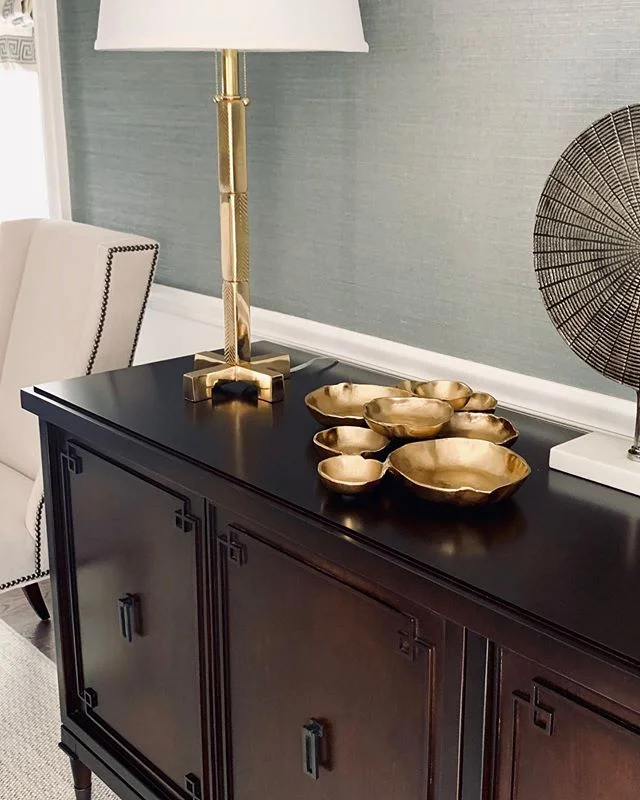 I love everything about this - from the brass detailing on the lamp to the custom designed walnut sideboard - just waiting on the hand hammered brass mirror to be installed - perfection! 💚