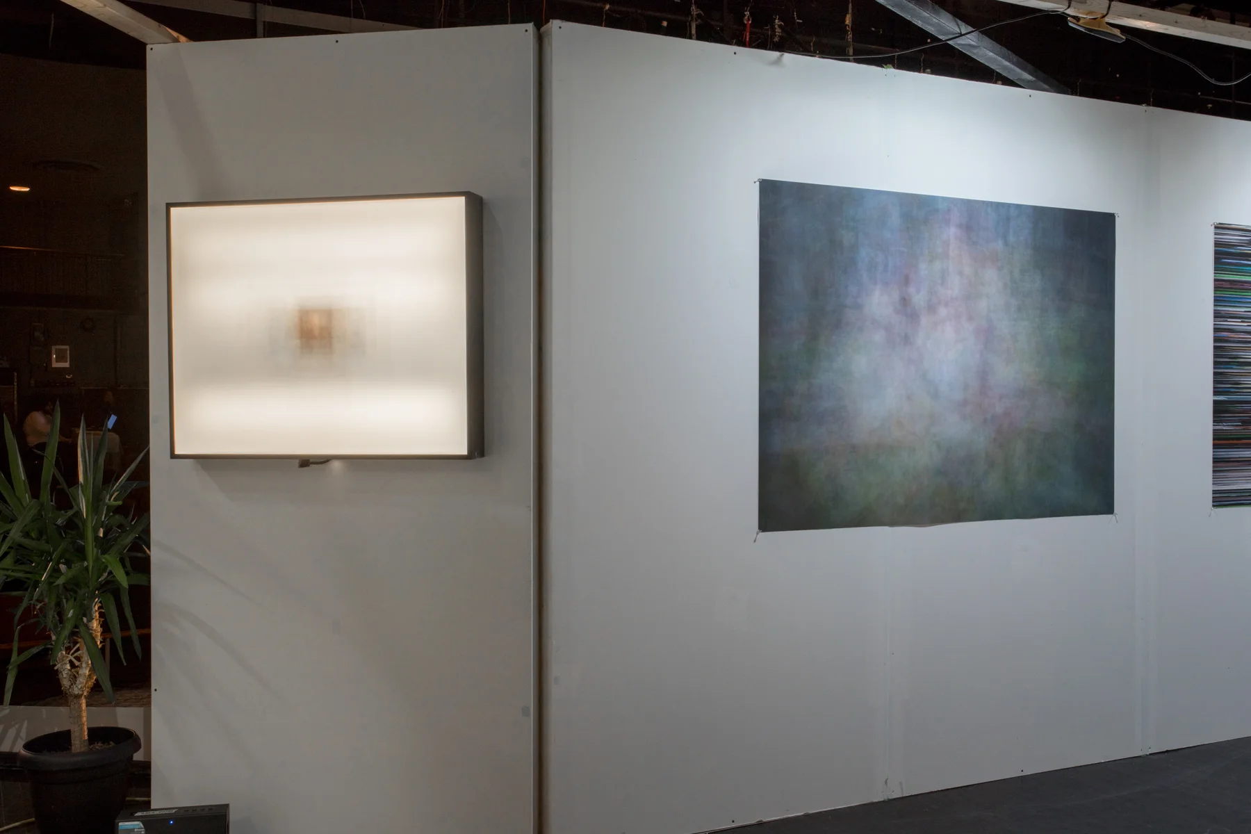 Installation view of Self Portrait (Divisible) and Surface of a Child 1 , displayed at Portfolio Day 8, November 3, 2017.
