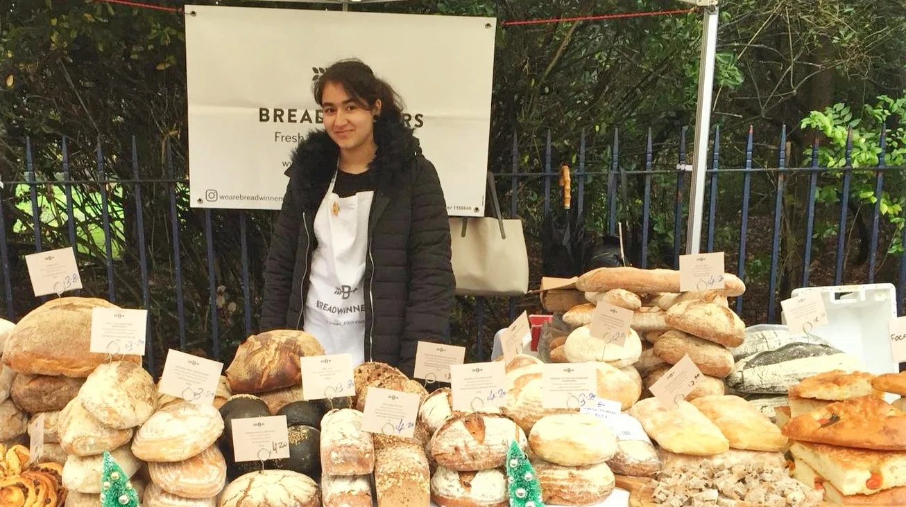 Diwa doing work experience at the Breadwinners stall.