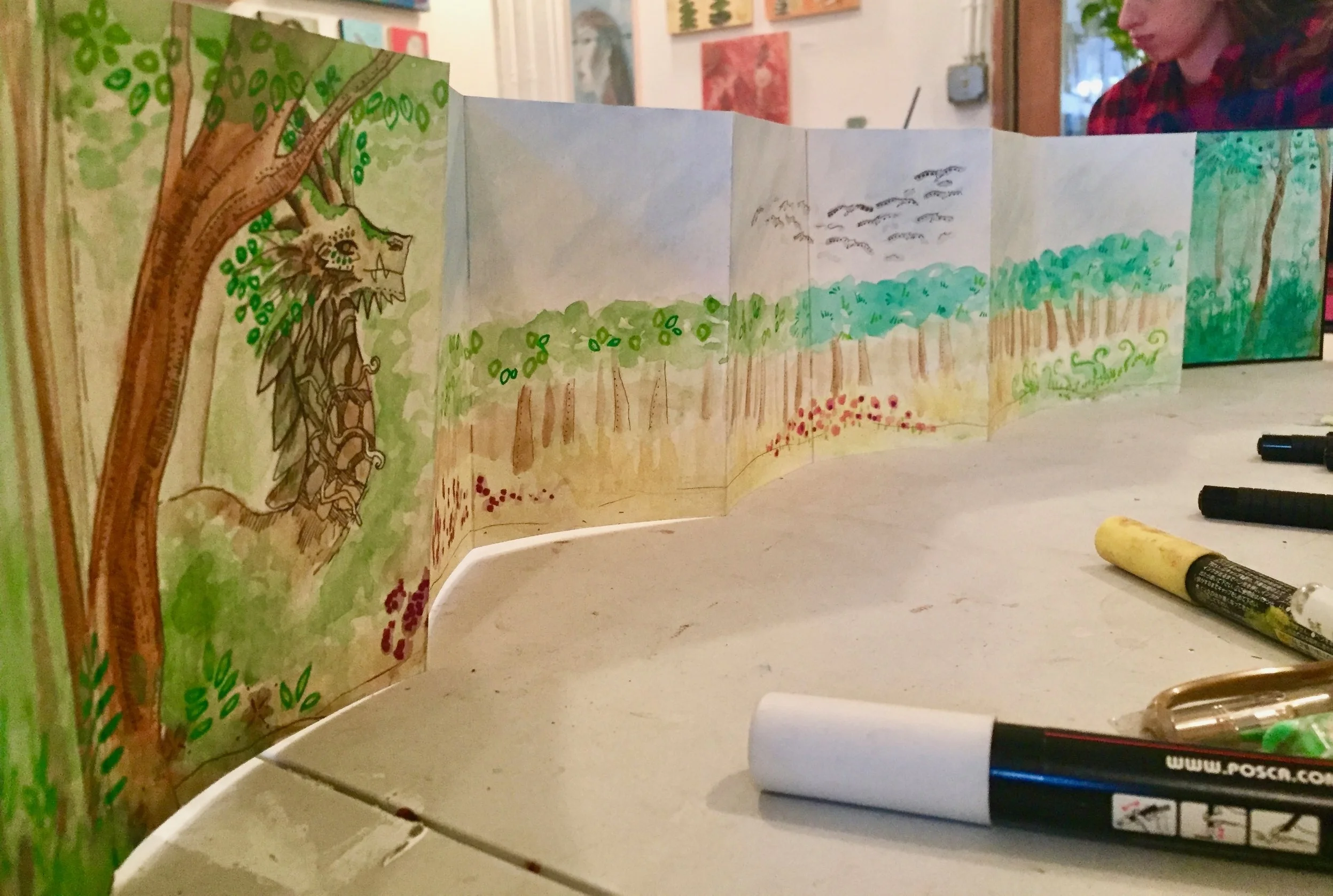 A beautiful mixed media accordion book created during a studio arts internship