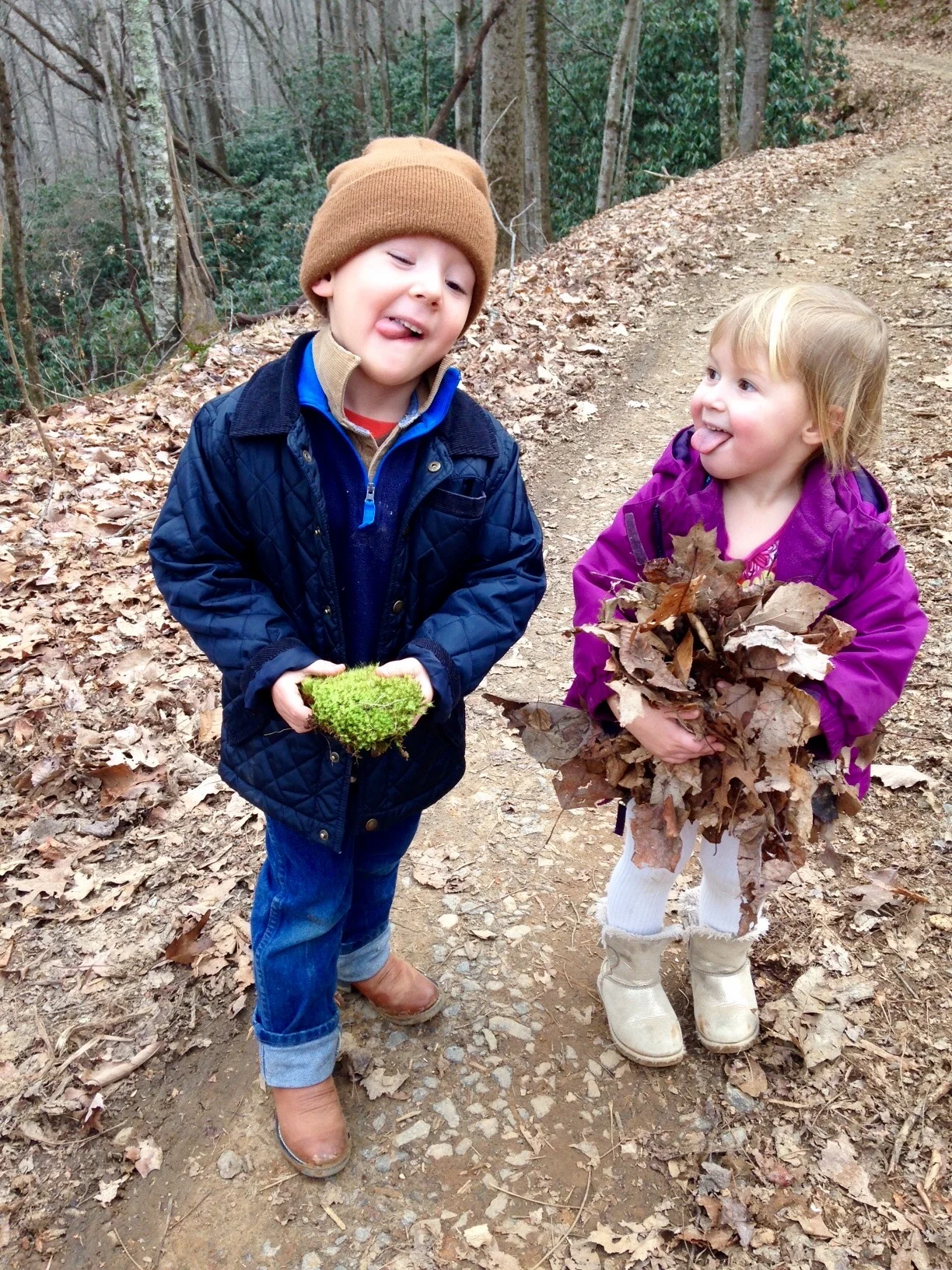 Friends mimicking silly faces during a nature walk