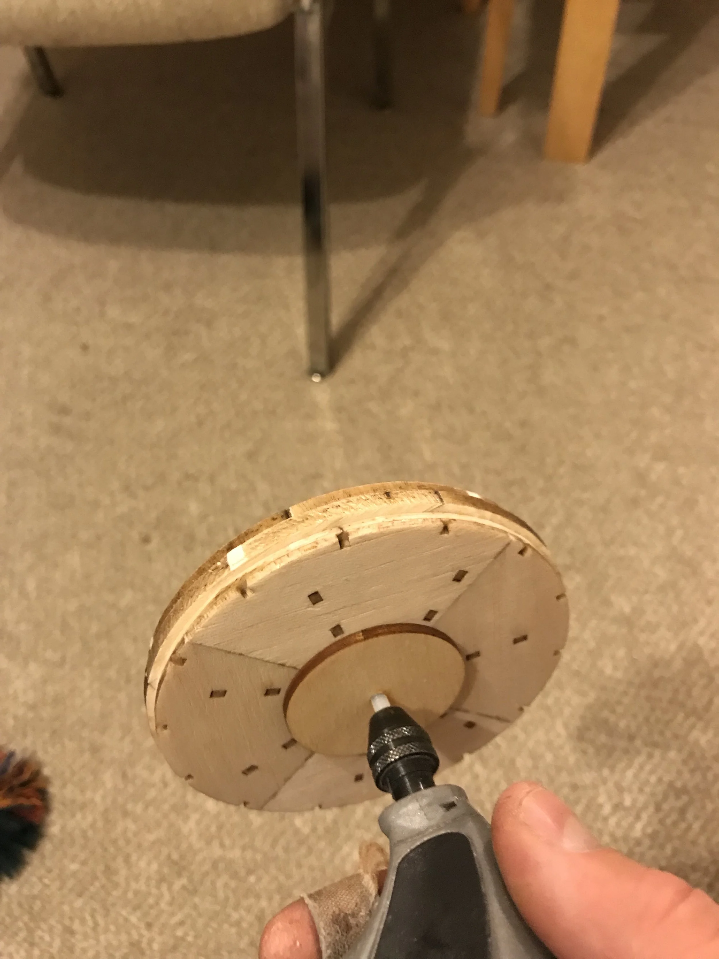 Rear view of cowl front with turning clamp and assembly chucked in drill