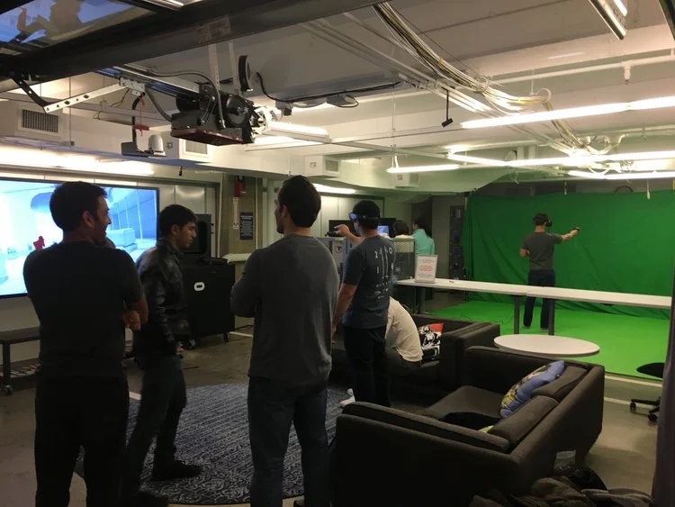 AT A RECENT EVENT, VR CLUB MEMBERS MINGLE WHILE TRYING OUT THE HOLOLENS AND HTC VIVE HEADSETS.