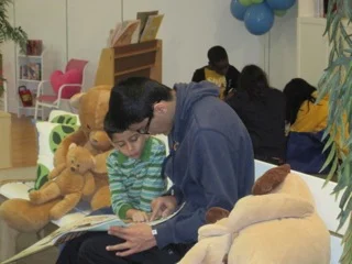 Huzaifa enjoys showing off his reading skills to his leader Obaid.