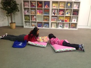 Hafsa and Saleeha enjoy relaxing with some pillows! Saleeha liked hearing about "God’s Dream" and both girls read some nursery rhymes together.