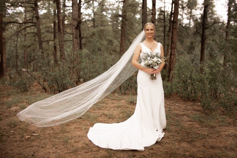 Bride Kayley on her wedding day with her veil.