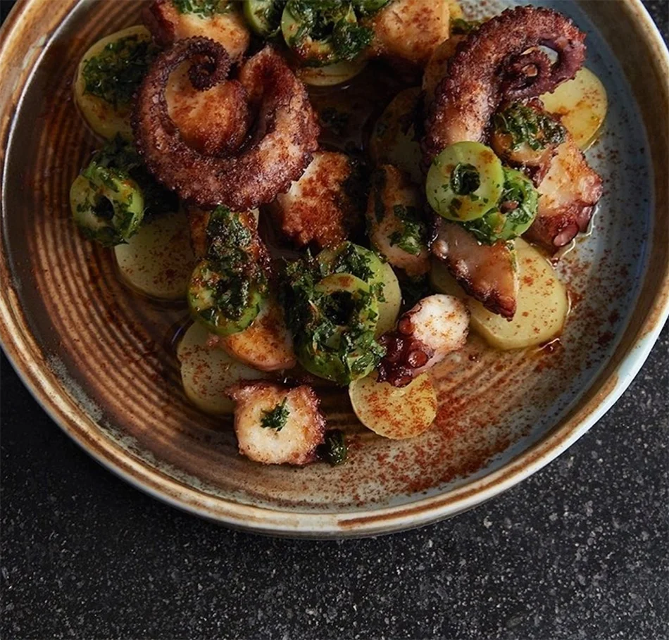 A hearty dish of pulpo (octopus) with olives and fingerling potatoes at Barvale. 