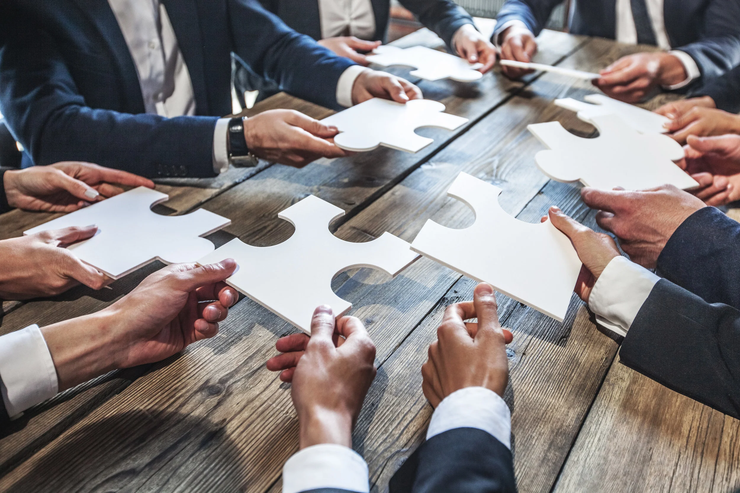 Business people and puzzle