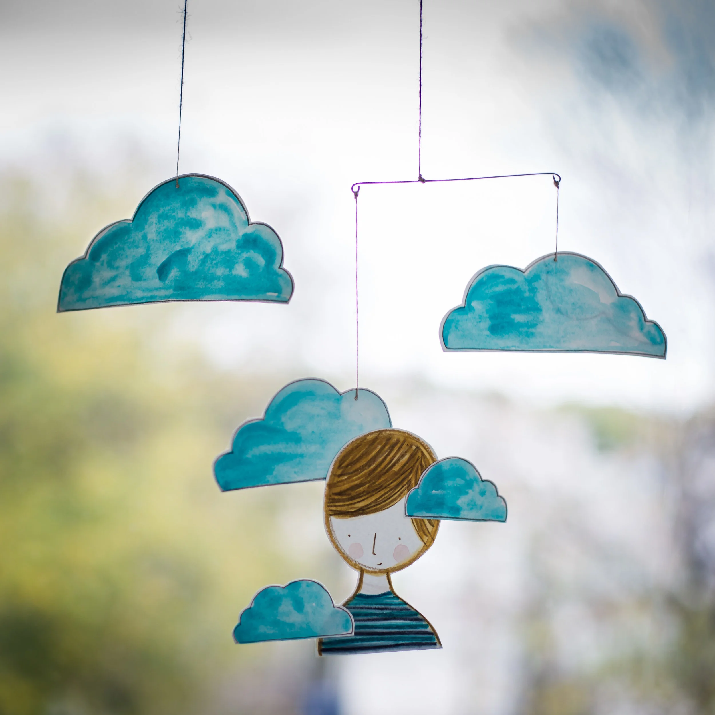 boy in the clouds hanging mobile
