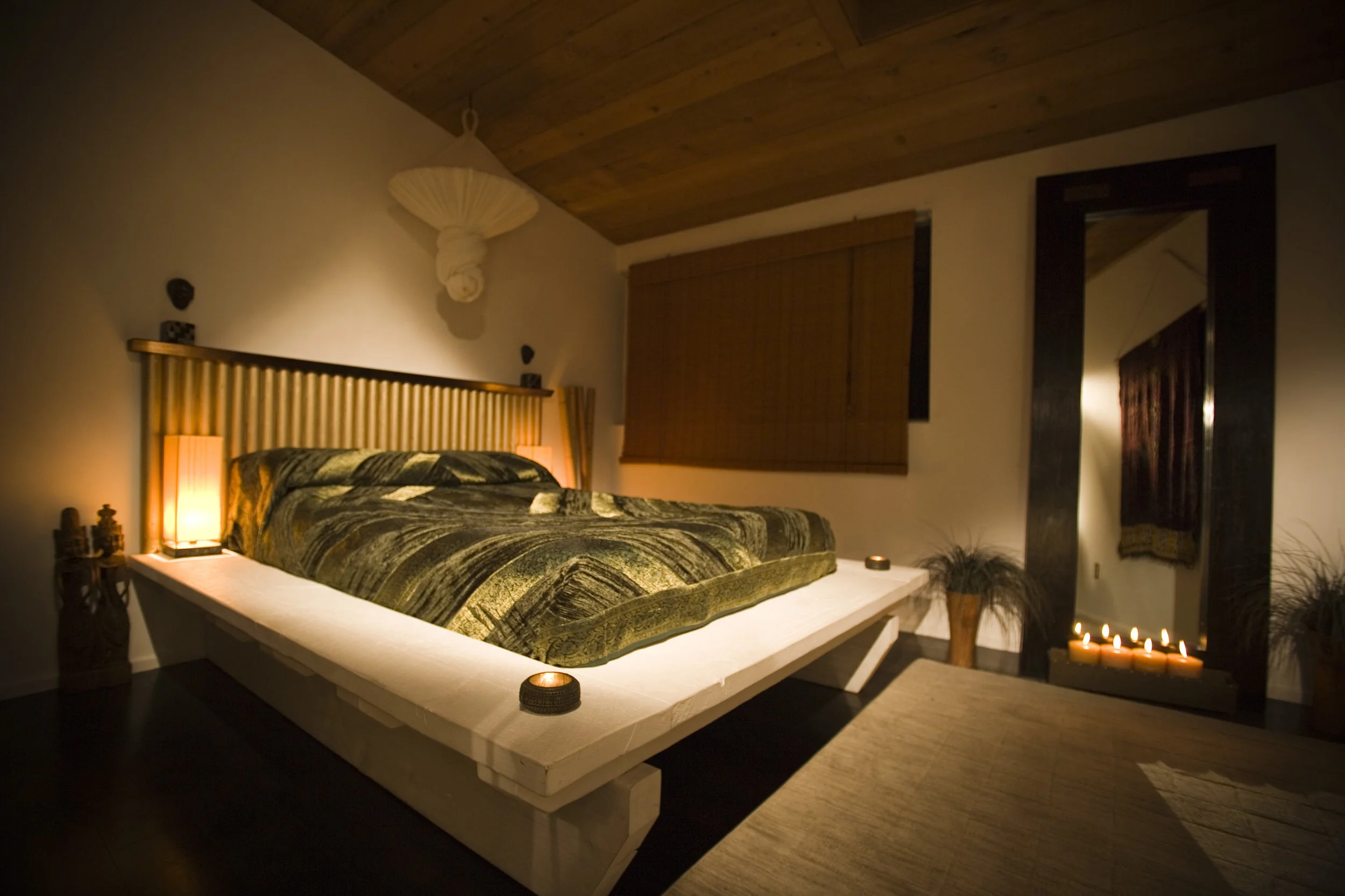 This platform bed and tall mirror was made with recycled wood and construction timber. 