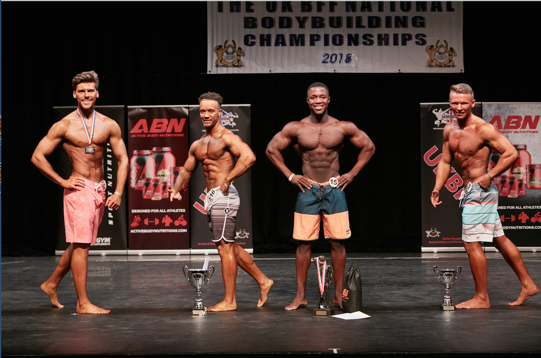 Isaac takes the junior men's physique class at the UK Nationals. Photo by Christopher Bailey.
