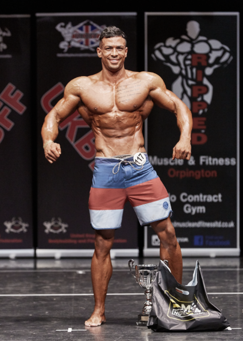 Muscular men's physique champion Aaron Clarke by Christopher Bailey.