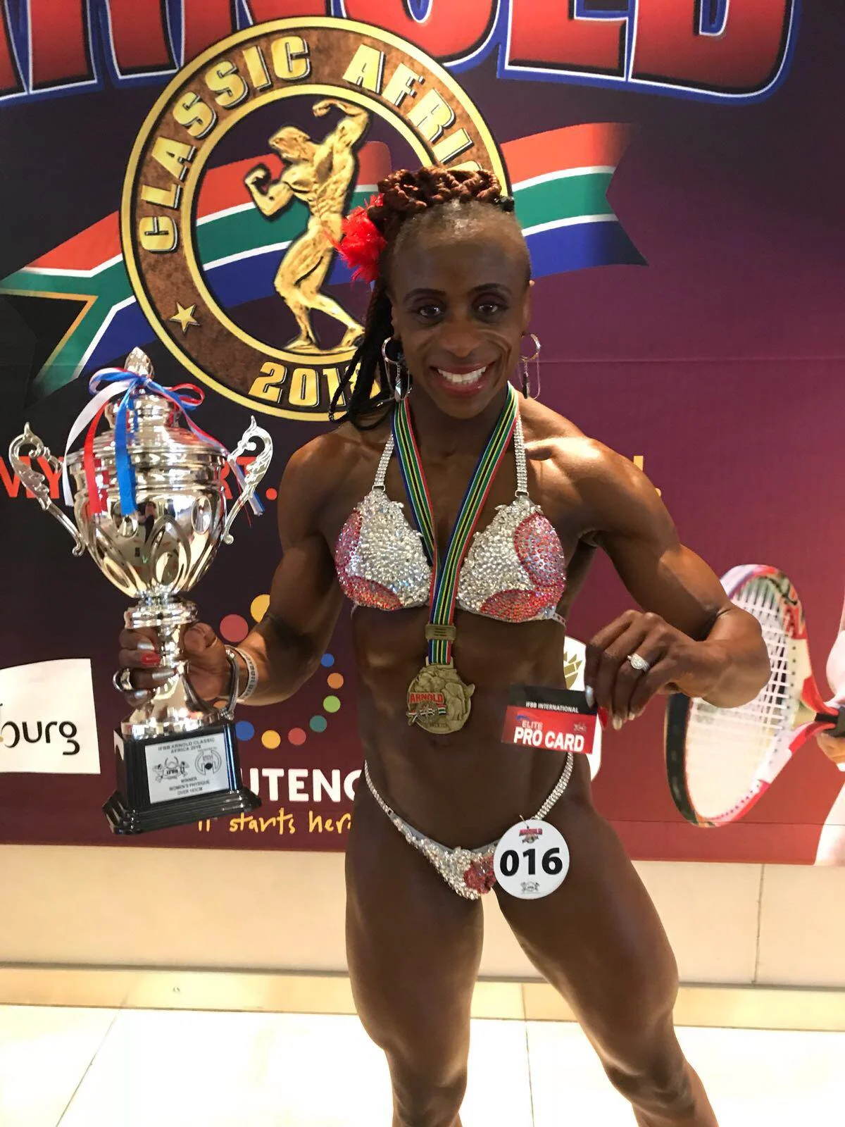 Ade celebrates winning her IFBB Elite Pro card in South Africa