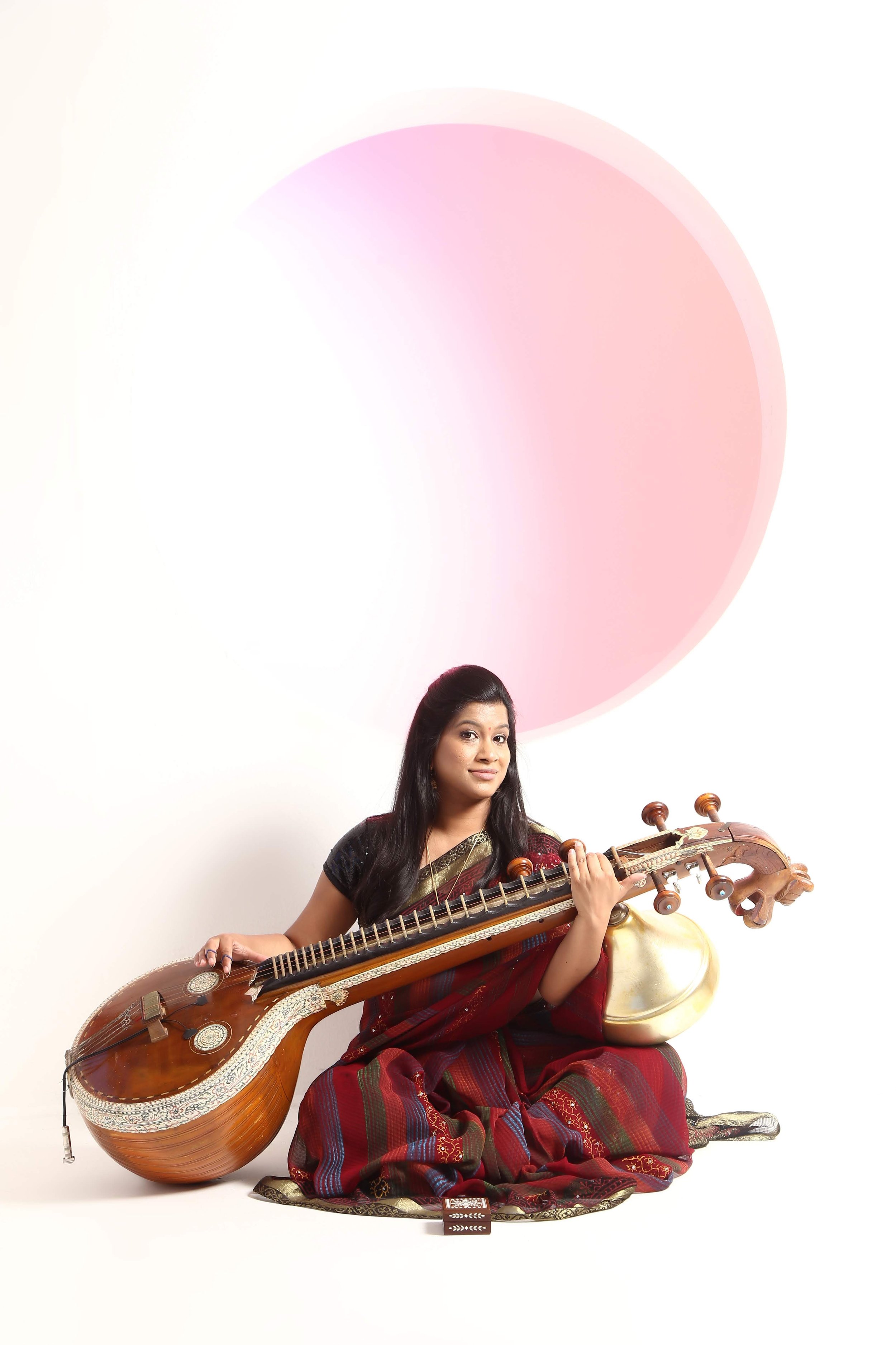 Arani Siva Red Saree Playing Veena.jpg