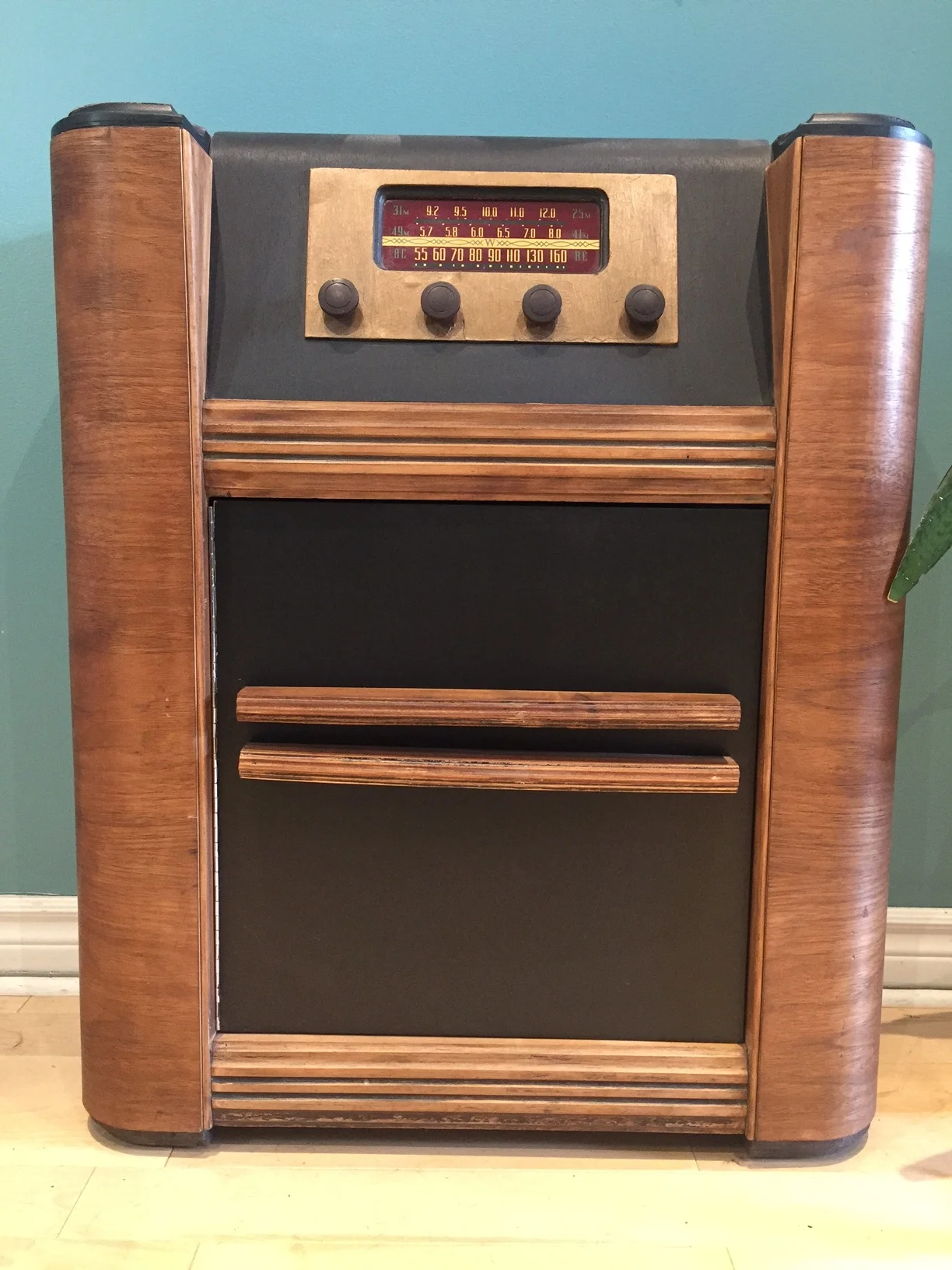  Storage unit - This was a radio. The speaker has been removed and replaced with a shelf and a door for storage. 