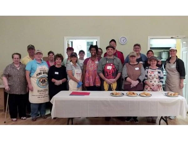 Volunteers are prepared to serve a meal at the First Parish Church of Stow and Acton monthly Guest Table dinner