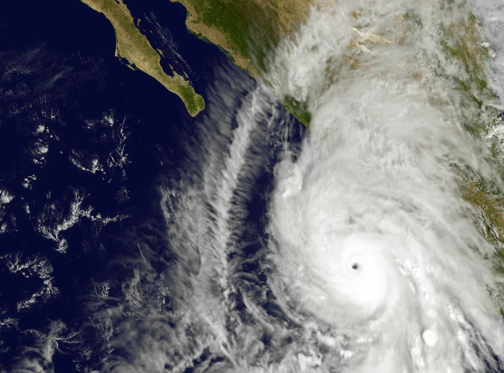 This satellite image taken at 1:45 p.m. EDT on Friday, Oct. 23, 2015, and released by NASA, shows the eastern quadrant and pinhole eye of Hurricane Patricia moving towards southwestern Mexico. The Category 5 storm is strongest ever in the Western Hemisphere, according to forecasters. (NOAA GOES Project/NASA via AP)