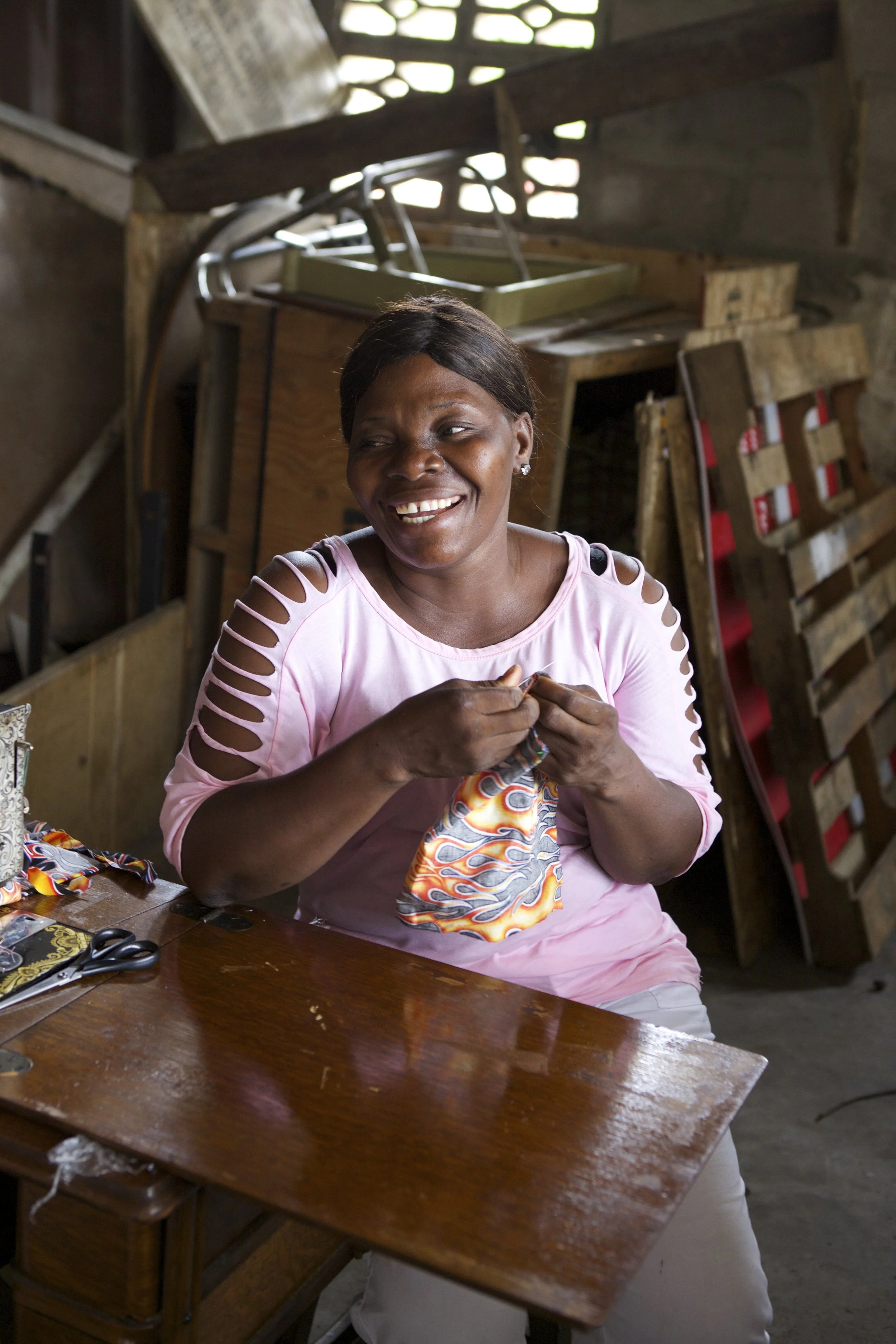 Marie, above, wants to earn money so her children can finish school, something a manipulative guardian prevented her from doing herself. Now, she can gain dignity and respect through her work.