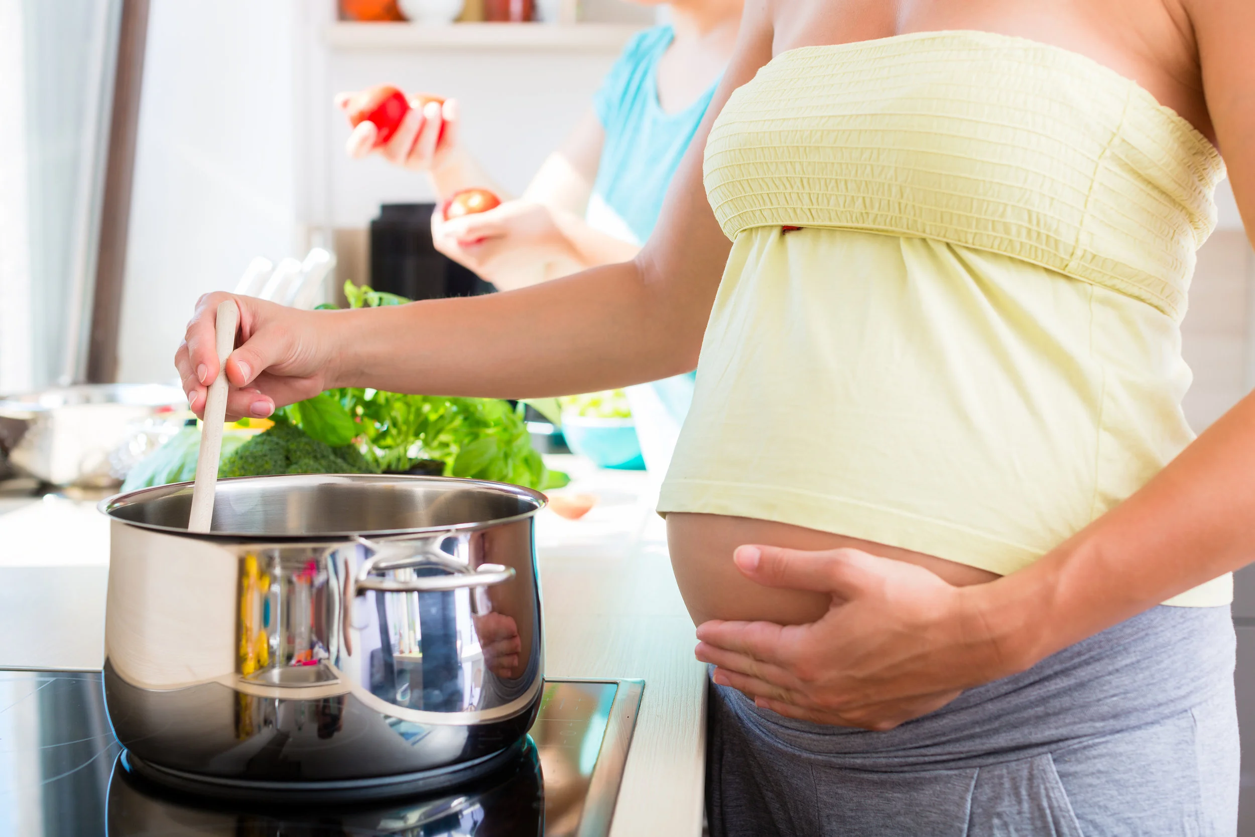 bigstock-Pregnant-woman-cooking-with-be-126116069.jpg