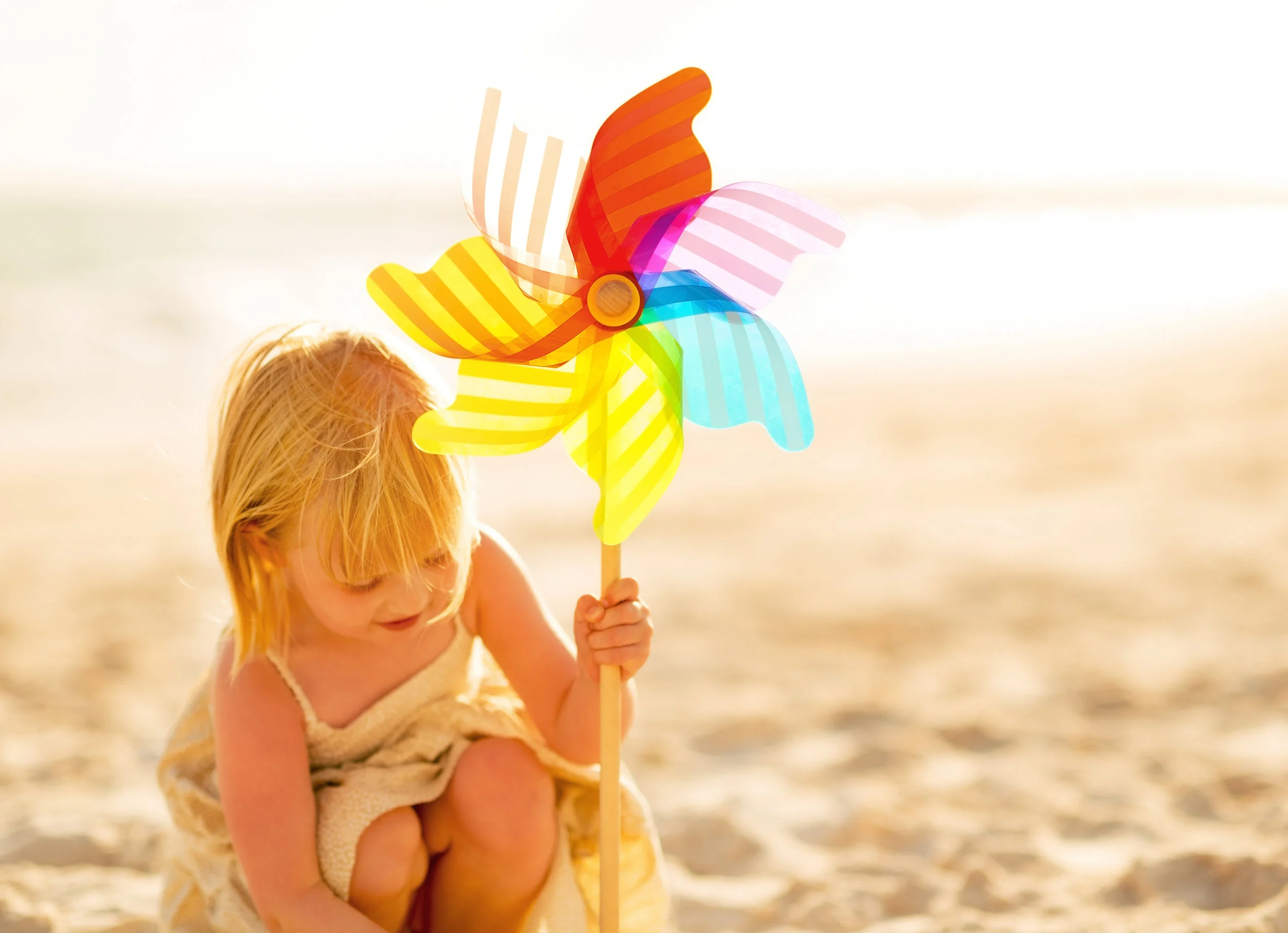 bigstock-Baby-Girl-Playing-With-Colorfu-77429423.jpg