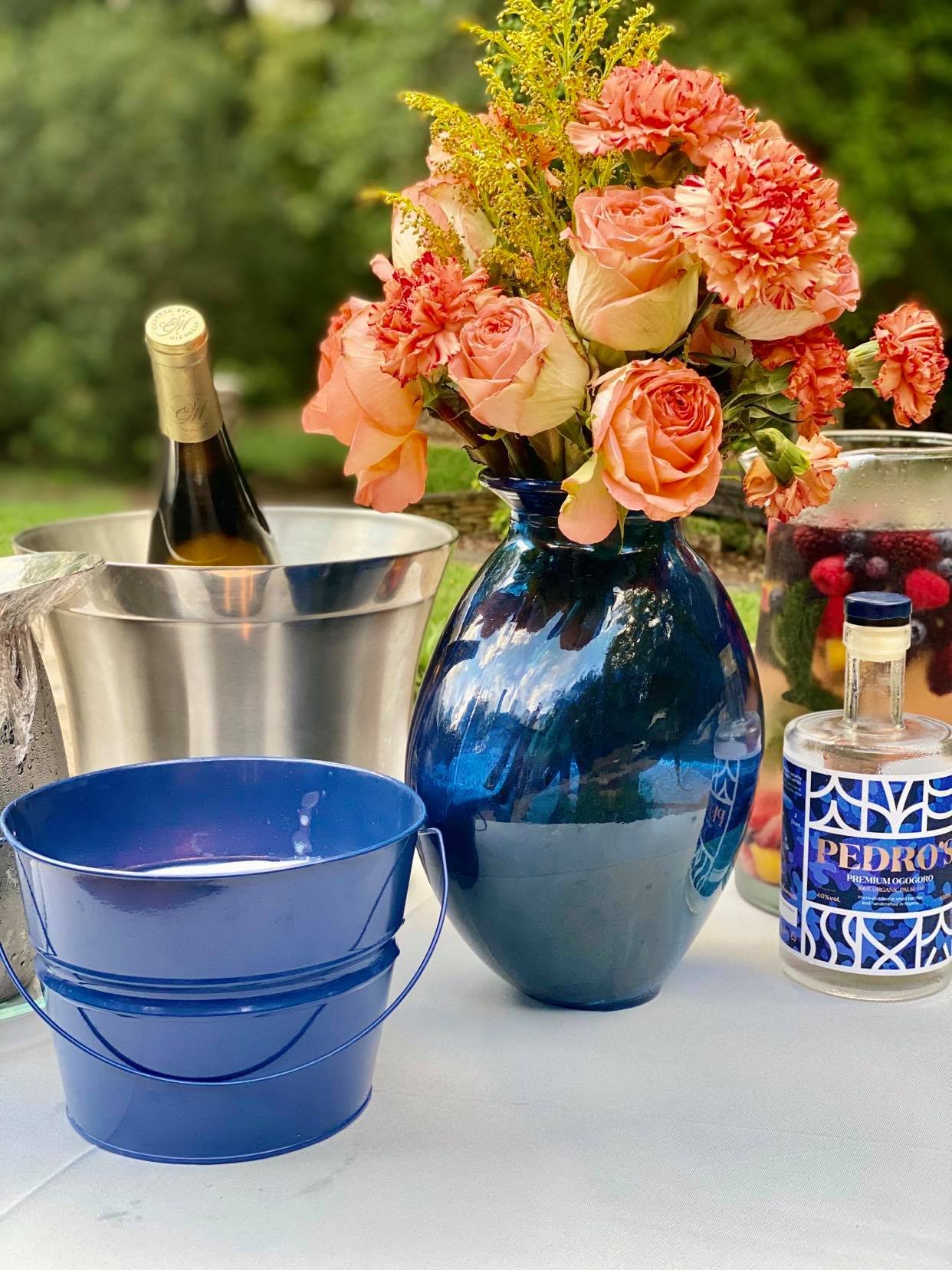 flowers in blue vase and wine.jpg