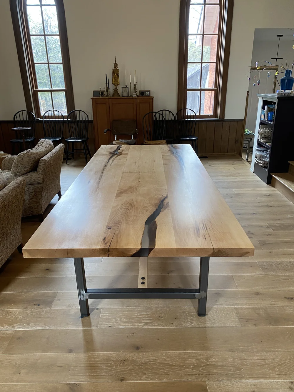 A reclaimed wood table with epoxy filler for a stylish toronto home