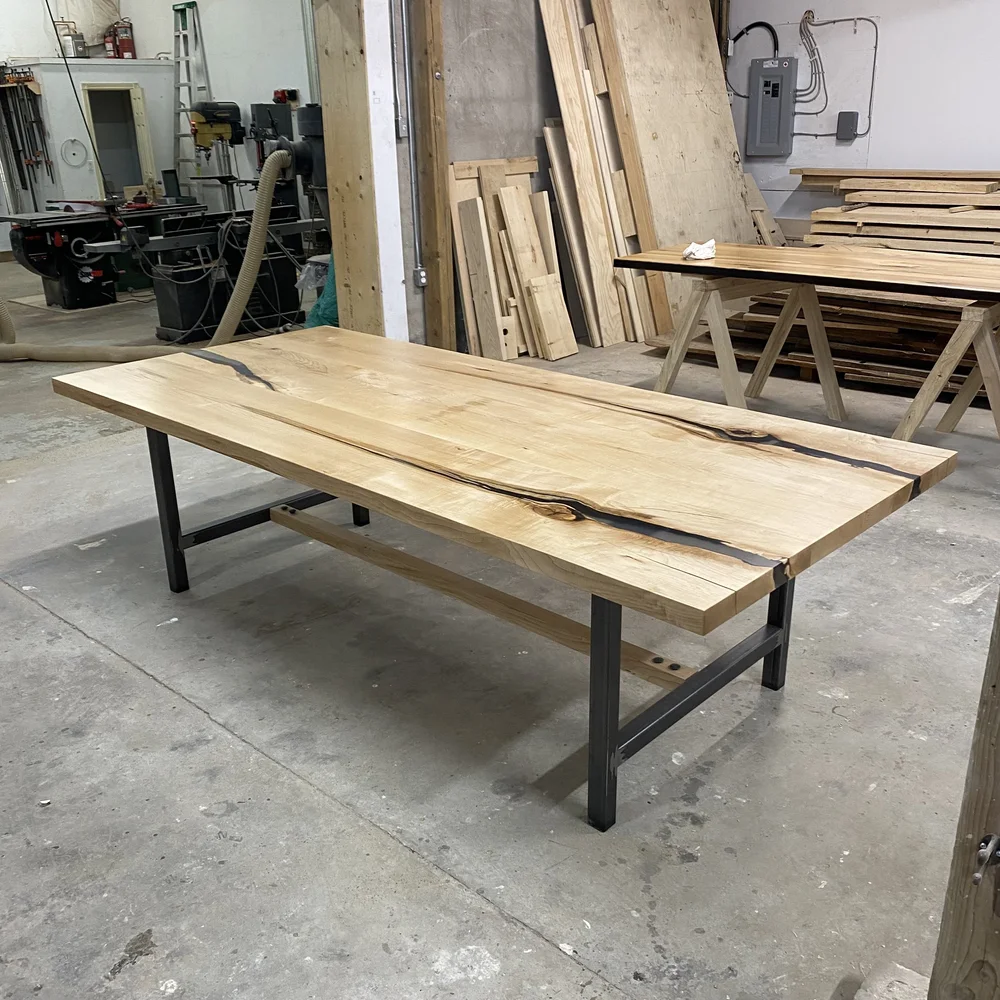 A reclaimed wood table with epoxy filler for a stylish toronto home