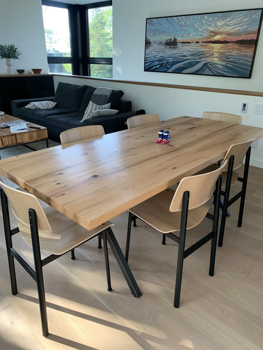 A custom made reclaimed wood table for a dining area in a collingwood chalet.