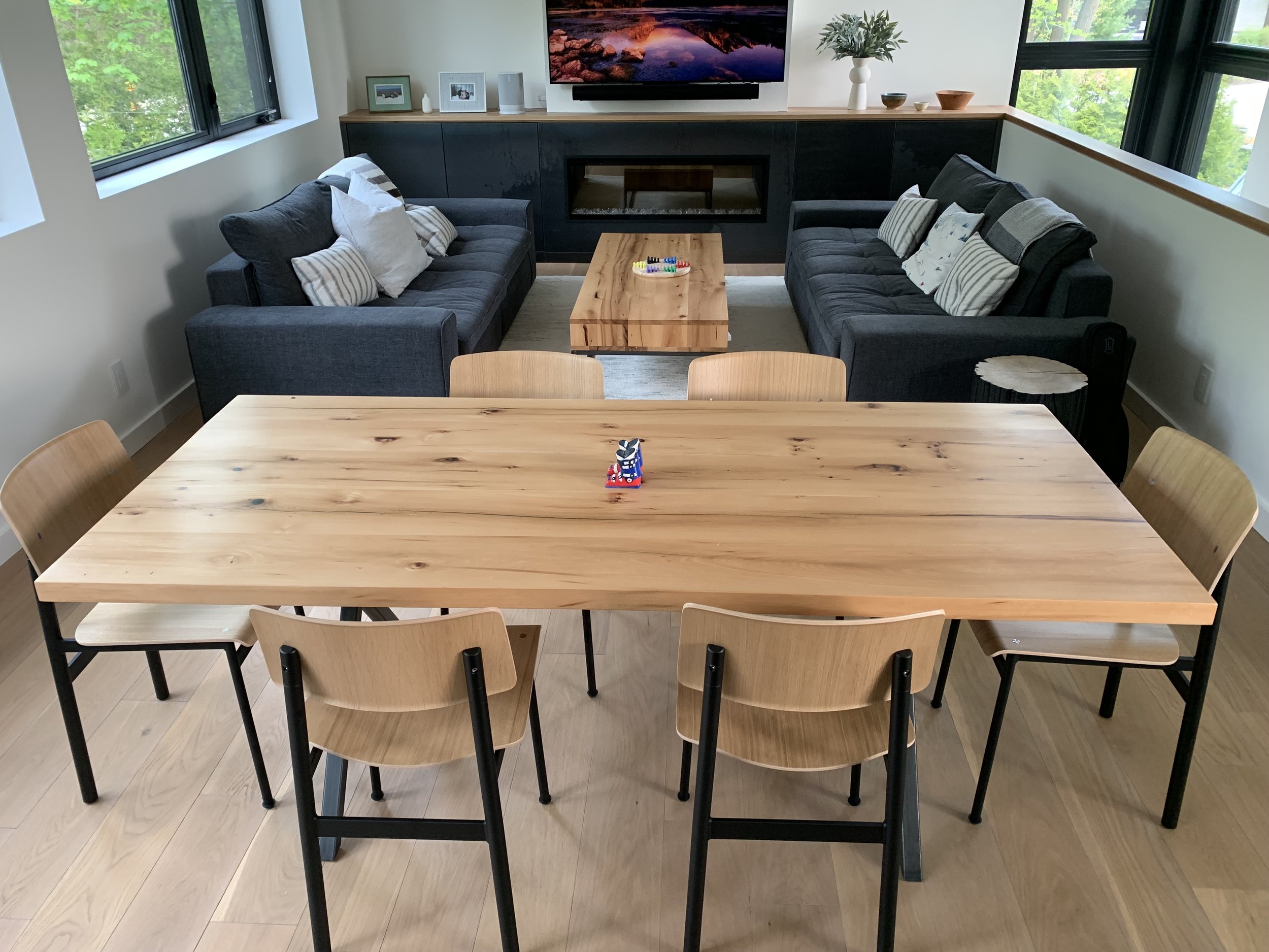 A custom made reclaimed wood table for a dining area in a collingwood chalet.