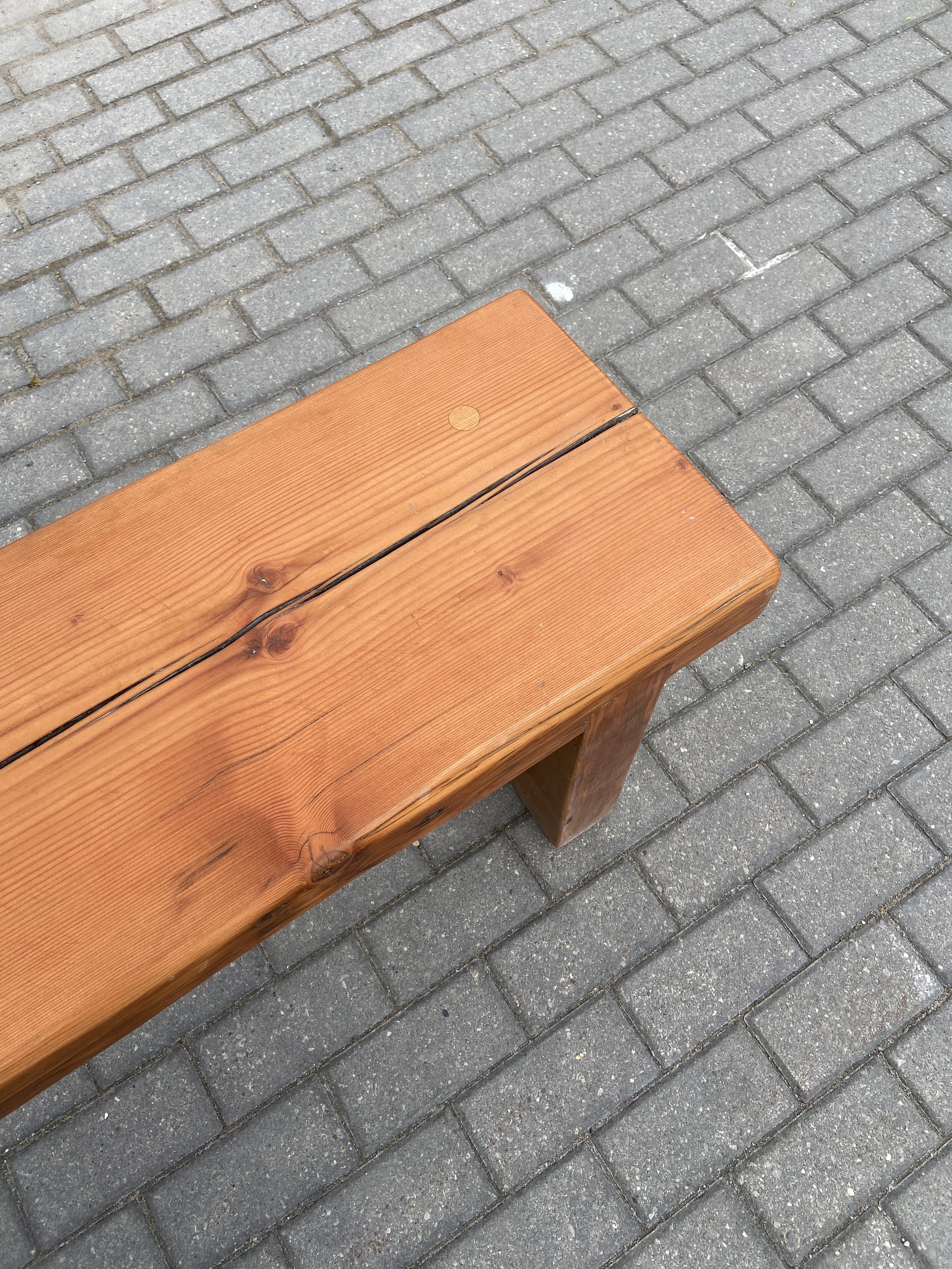 A custom douglas fir bench sits outside at the evergreen brickworks