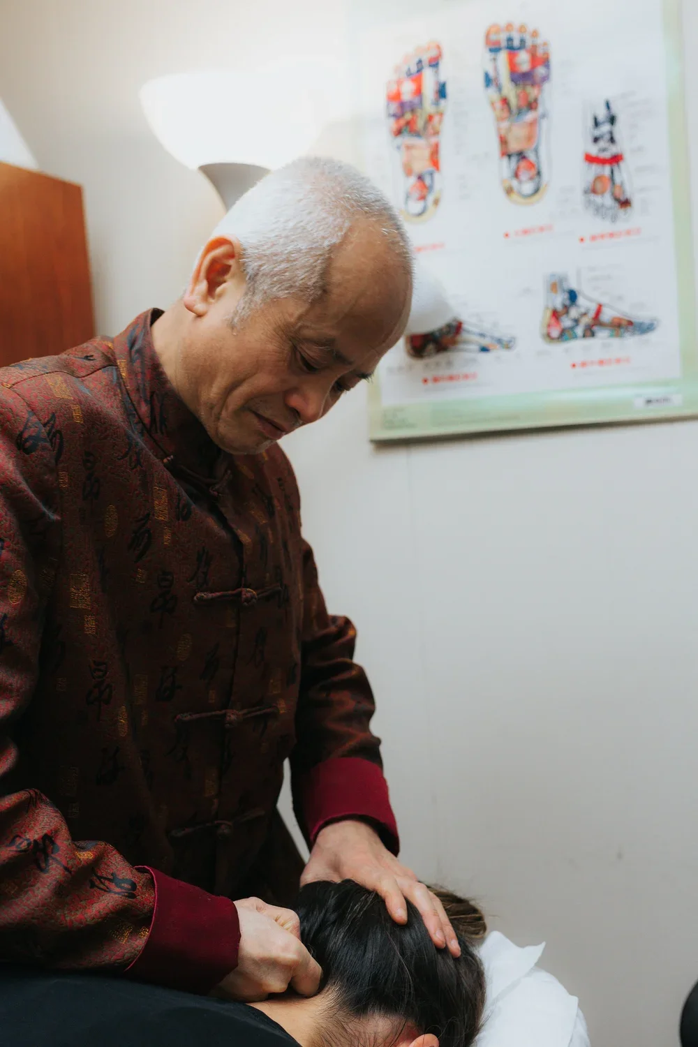 Dr Wu doing Tui Na 2.webp