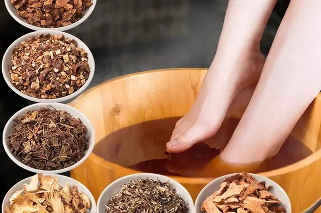 Chinese herbal foot soaking therapy with mugwort and citrus peel in a wooden foot bath
