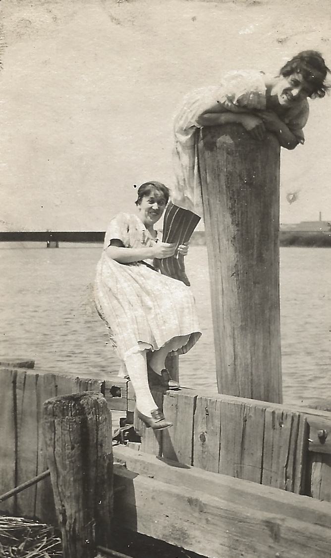 That’s Bertha, impaled on that pole. And smiling! That’s her sister, Mabel, holding her legs.
