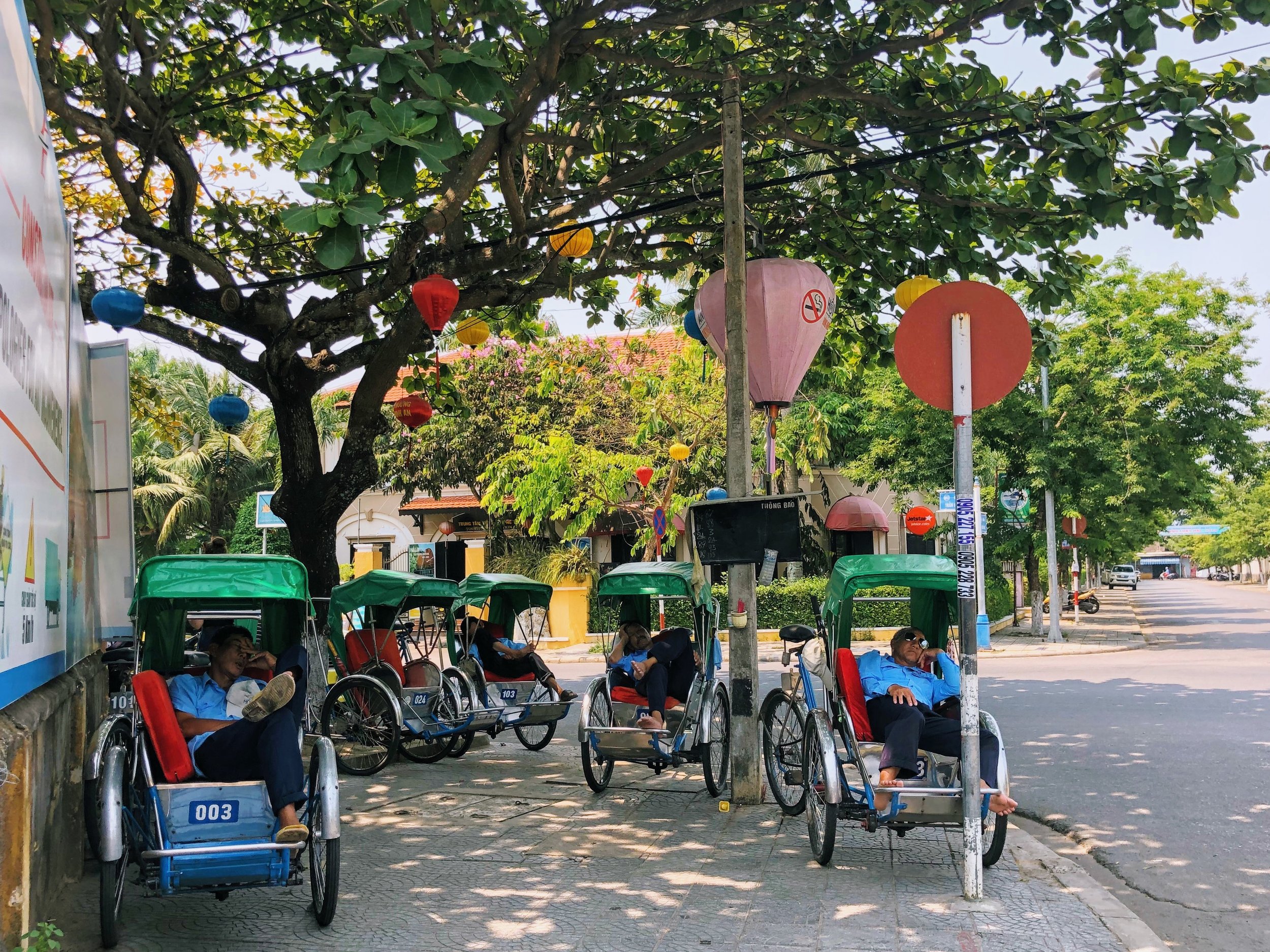  Cyclo drivers taking a siesta in the midday heat. 