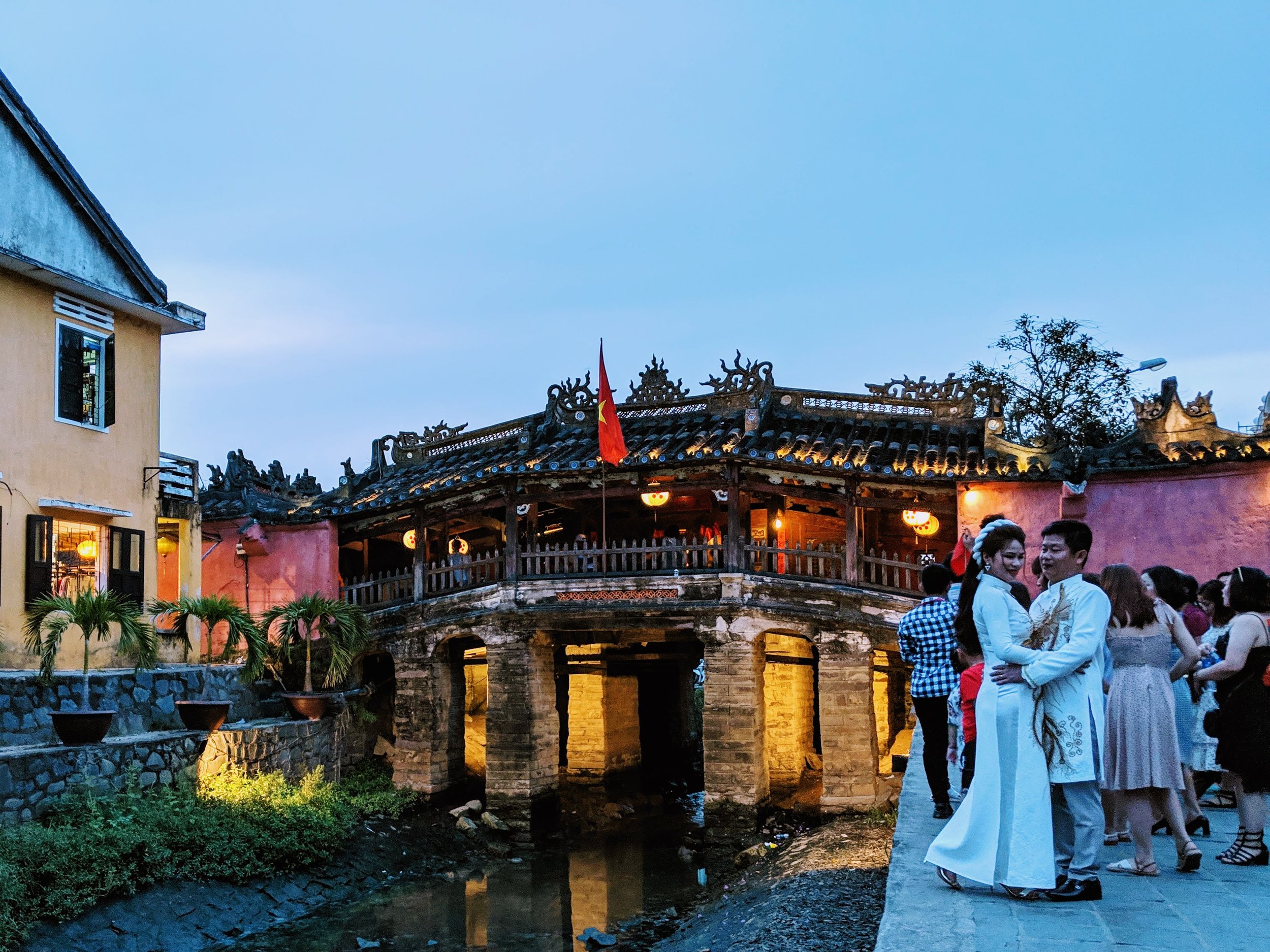  Iconic Japanese Bridge in Hoi An. Wedding couple posing for a picture. (Not the wedding I attended.) 