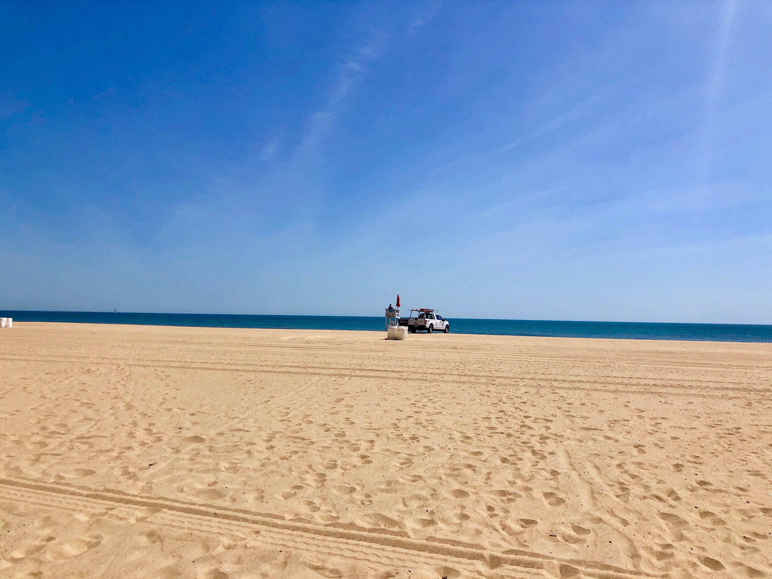 I took this picture at 11:15 Saturday morning from 38th Street on the Boardwalk. On a normal day, the beach would be filling up about this time.