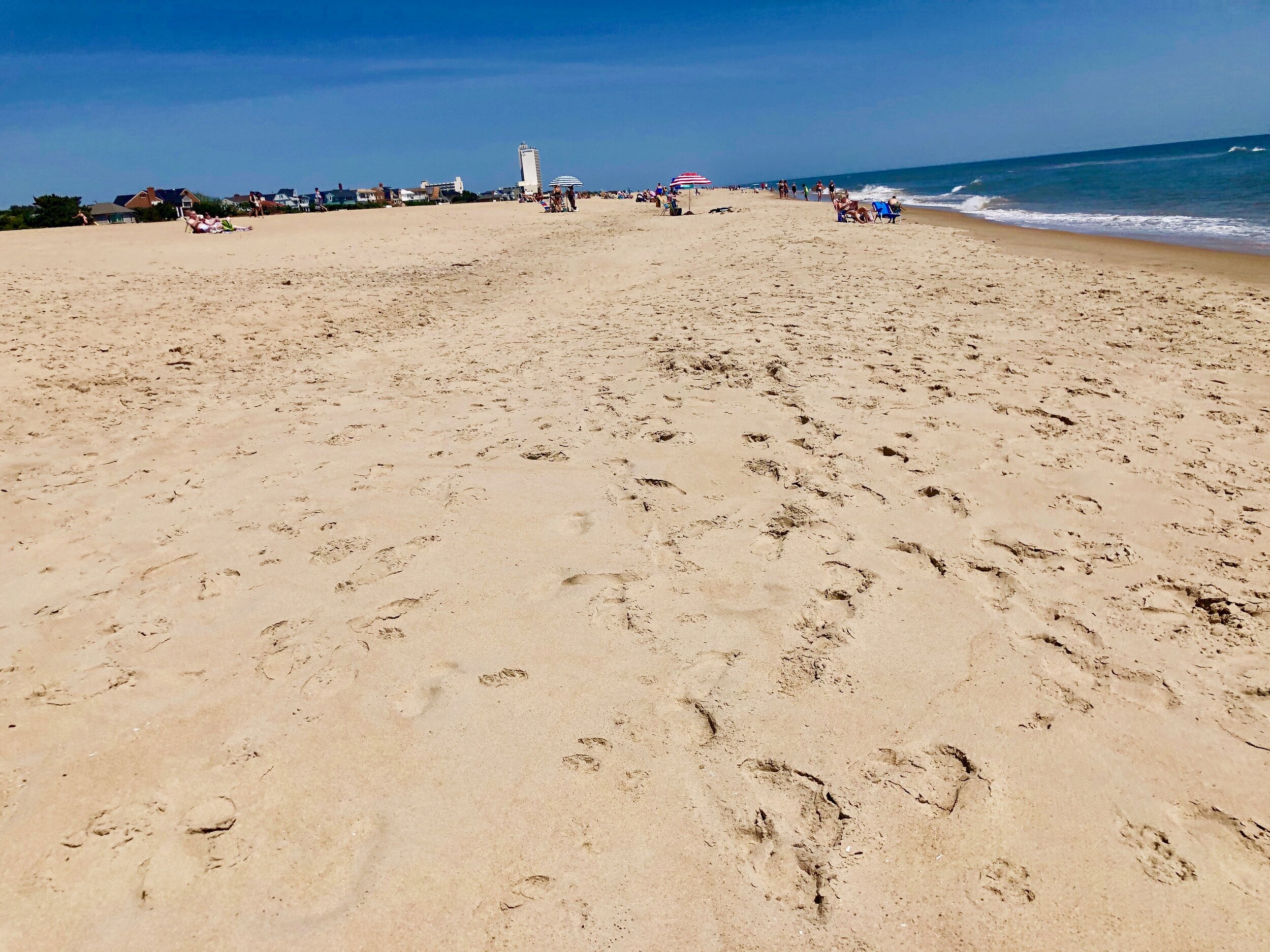 Looking north from 42nd Street around noon. A few umbrellas. A few chairs. Lots of fishermen. Ordinarily the beach would be far busier than this by lunchtime.