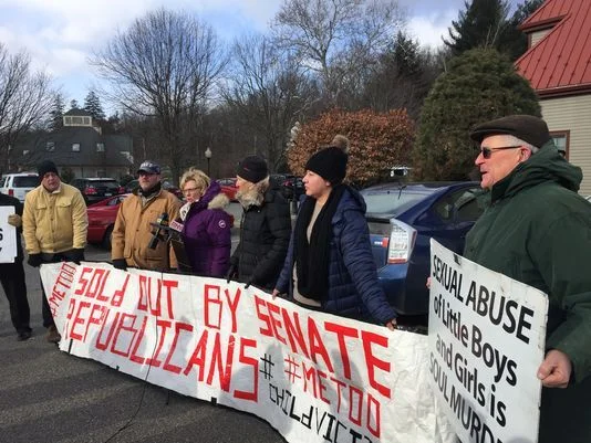 636487732601336902-child-abuse-protest.jpg