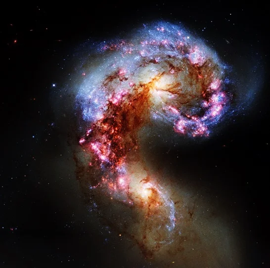 The Antennae galaxies, a pair of interacting galaxies located 45 – 65 million light years from Earth.
