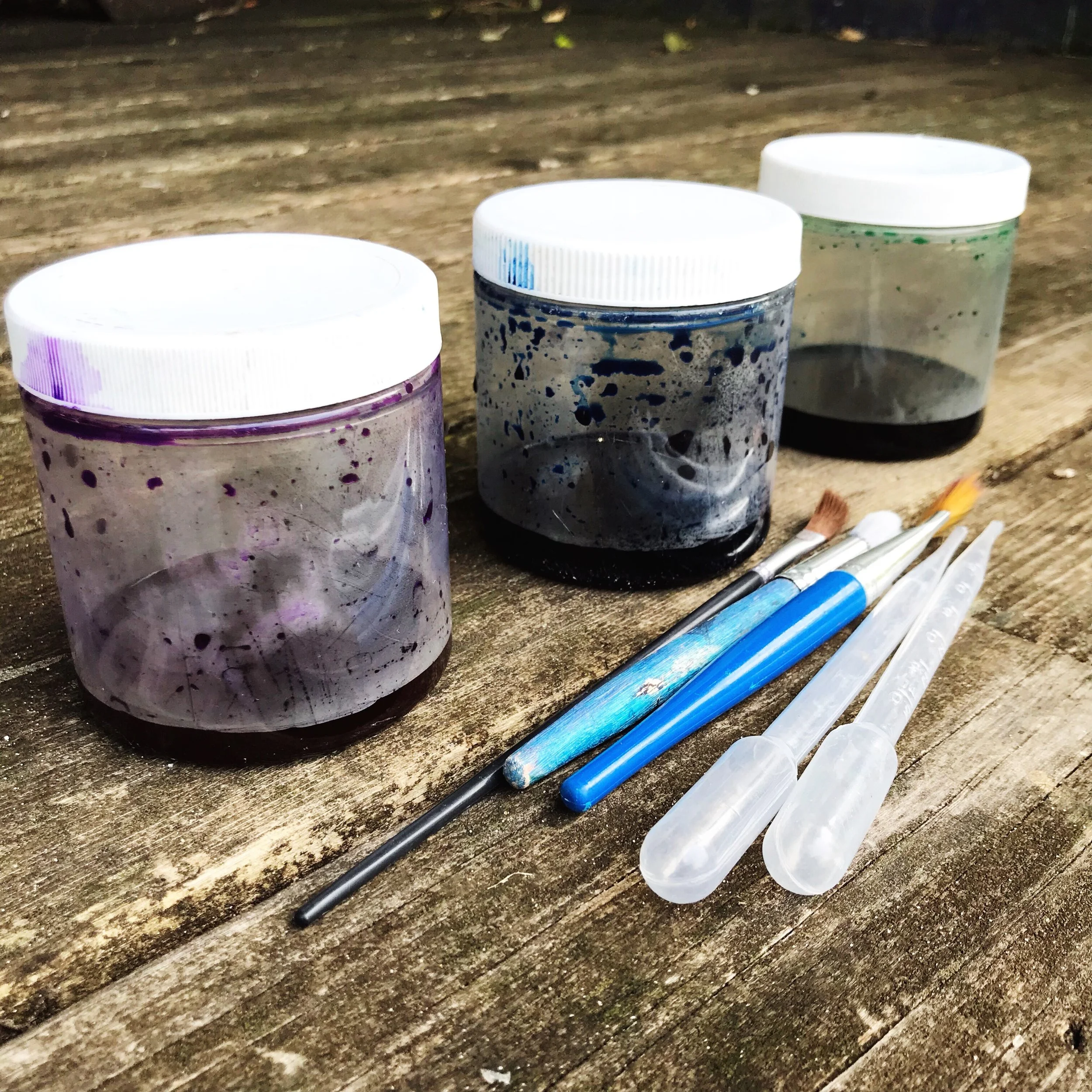 I transported my liquid water colors in these containers, then watered them down in small paper cups for painting.