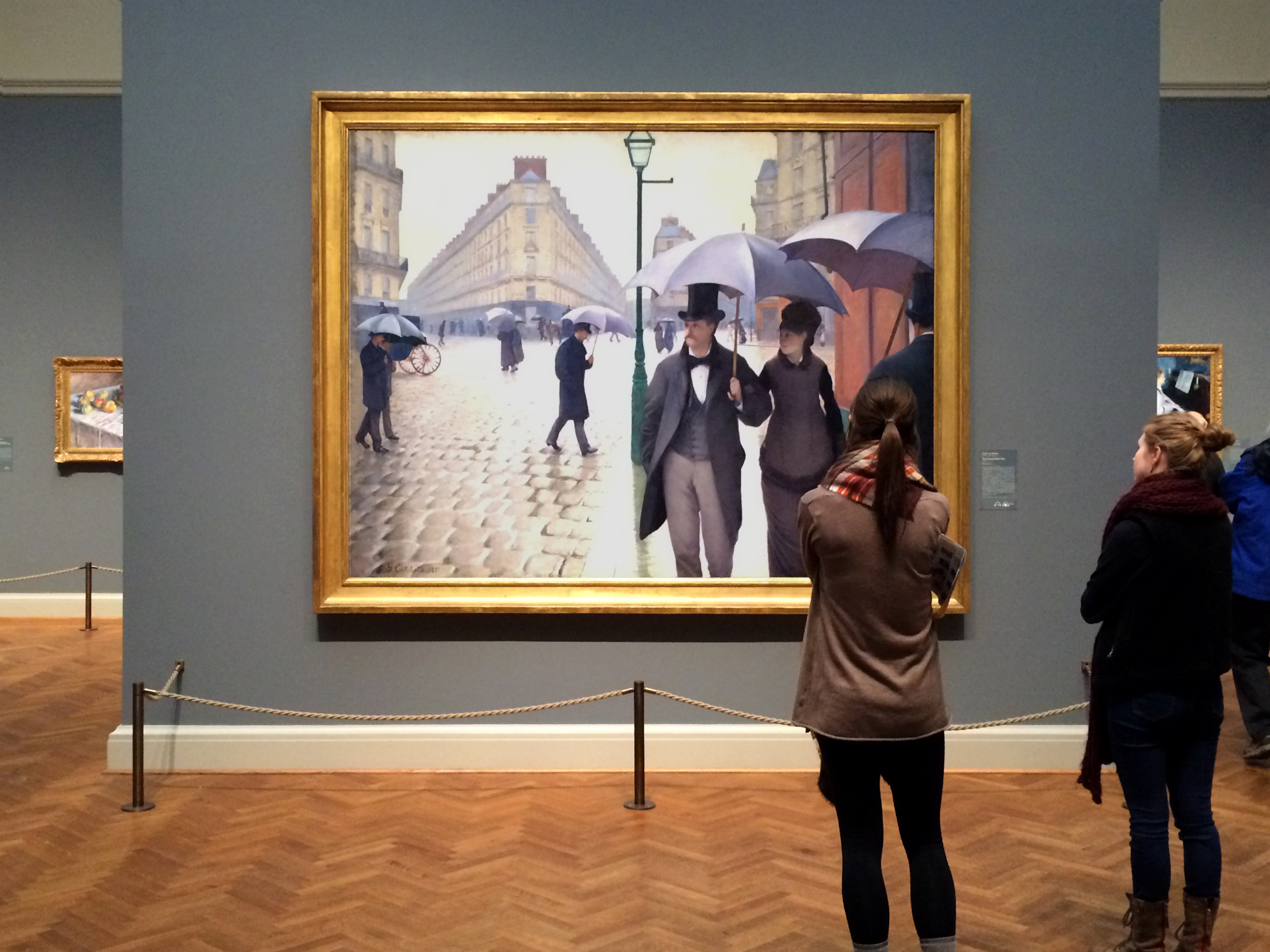 Gustave Caillebotte,  Paris Street; Rainy Day  (1877) on view at The Art Institute of Chicago. 