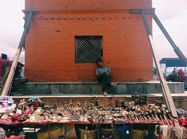 Sleeping vendor at Swayambhunath Temple
