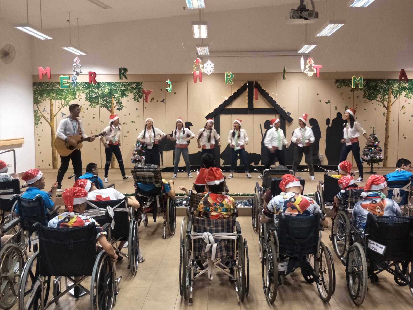Our enthusiastic HOME Christmas Carollers at work!