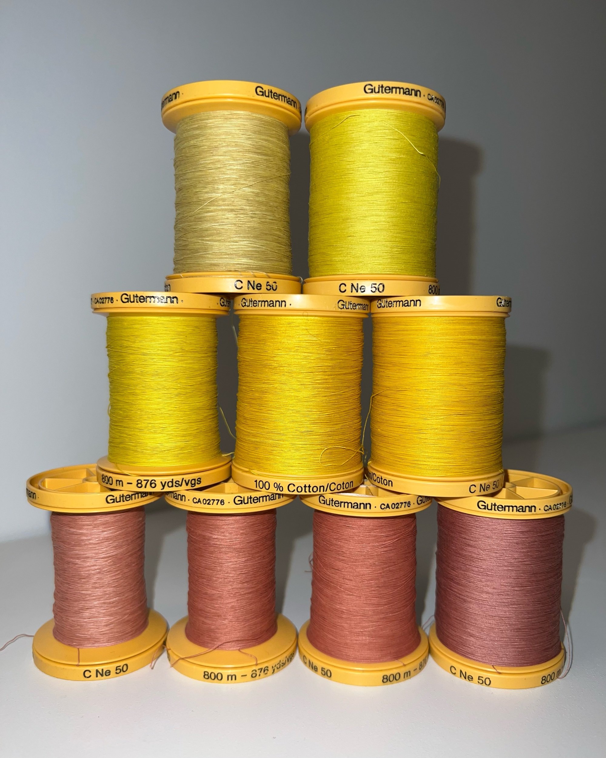  Hand-dyed cotton sewing thread with weld (top), turmeric (middle), and madder root (bottom) 