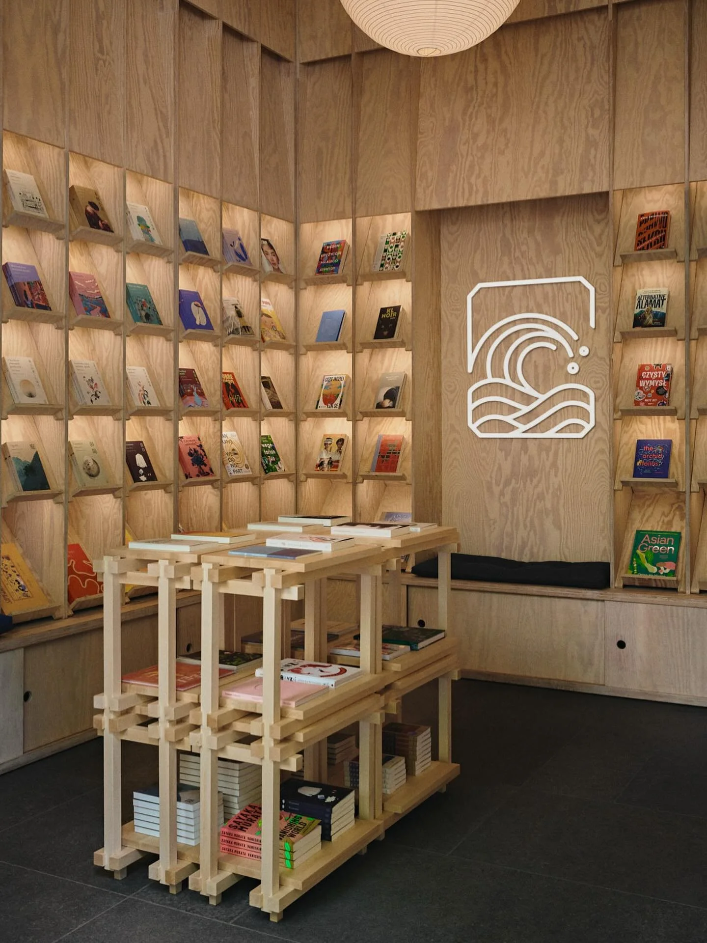 Our project for @tajfuny bookshop in Krak&oacute;w, photographed earlier this year by @tomo_yarmush.

Plywood shelving lines the interior of the shop creating separate &lsquo;niches&rsquo; for each book, as well as larger spaces for reading and displ