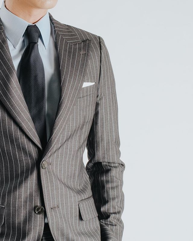 Our classic grey pinstripe, single breast with a generous width on the peak lapel. Future Classic.