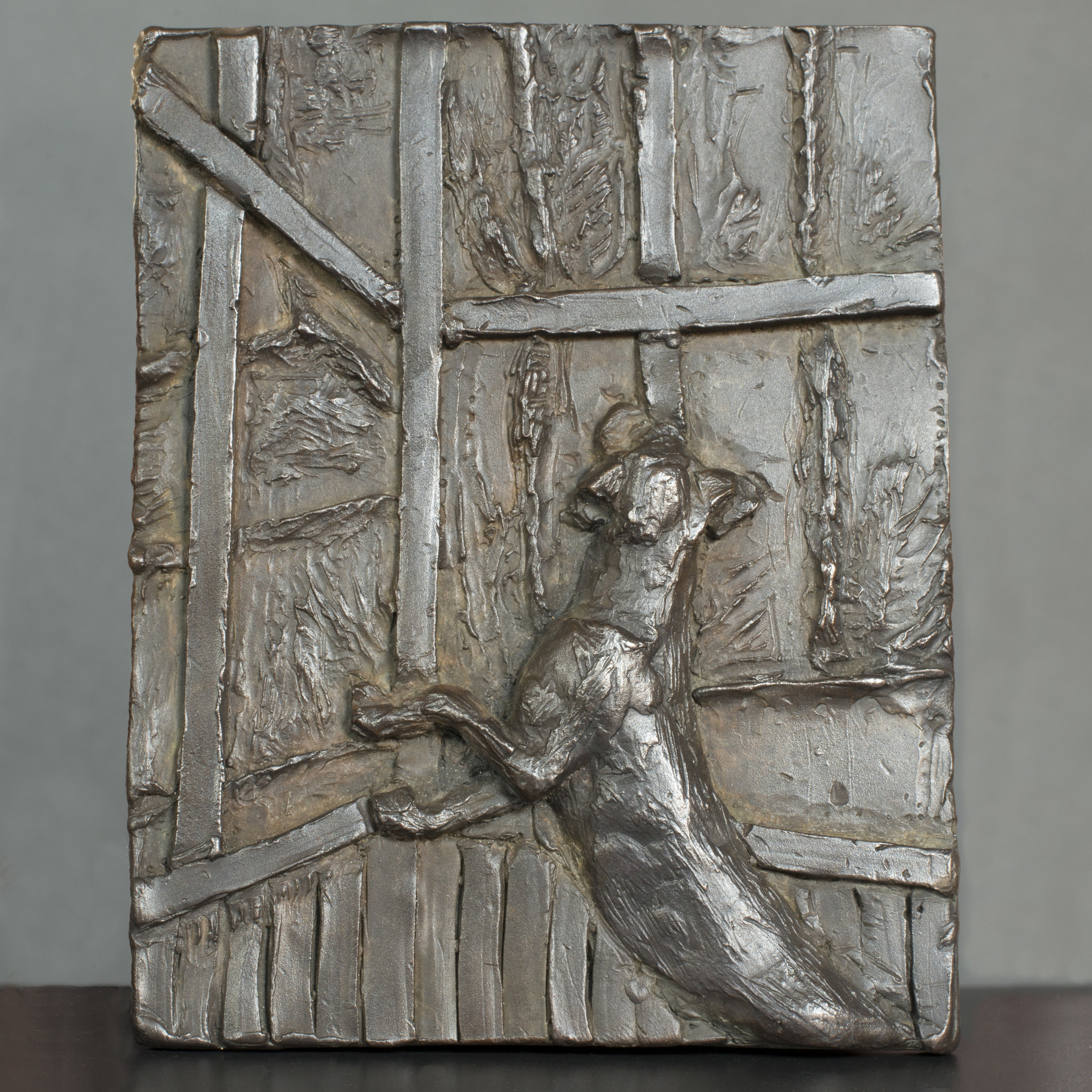 Dog at window (relief)