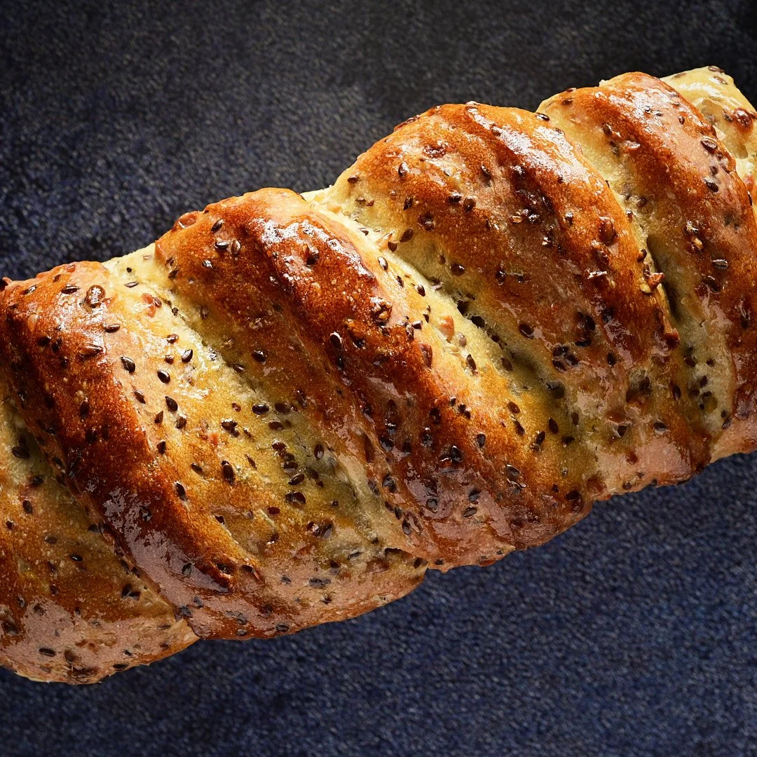 Artisan Sunflower Flax Sourdough Loaf – Crafted with a golden crust and rich seeds for a hearty, wholesome flavor. Perfect for Ottawa’s top cafés, restaurants, and caterers seeking standout, locally inspired bread for artisan sandwiches and gourmet p