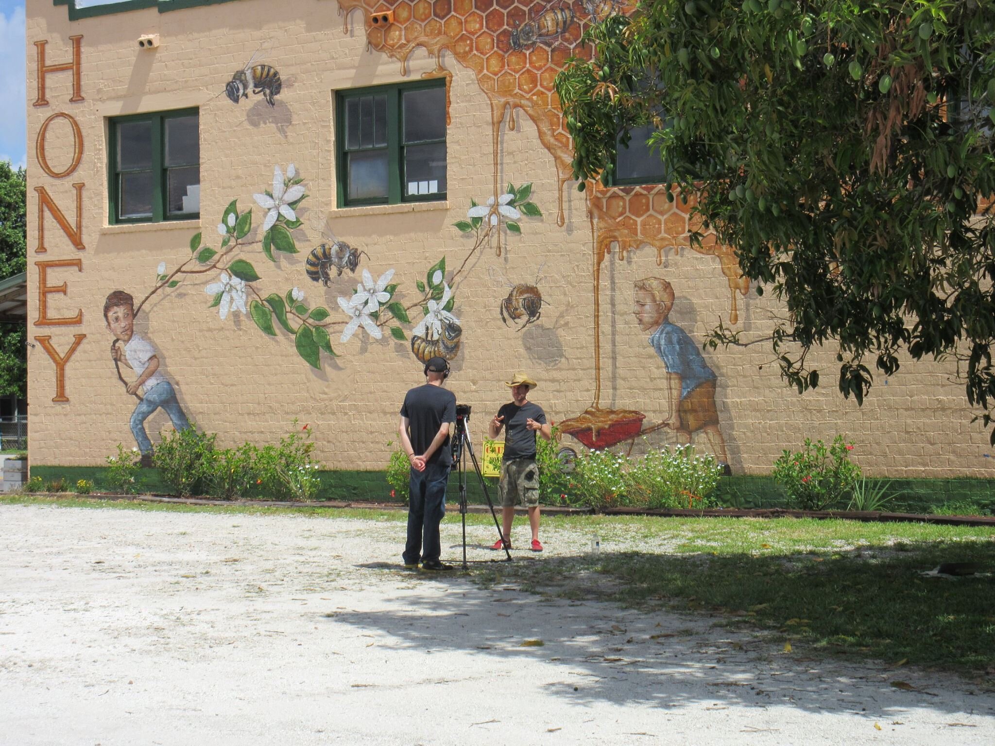 Matt Willey preparing to be photographed in front of the completed mural
